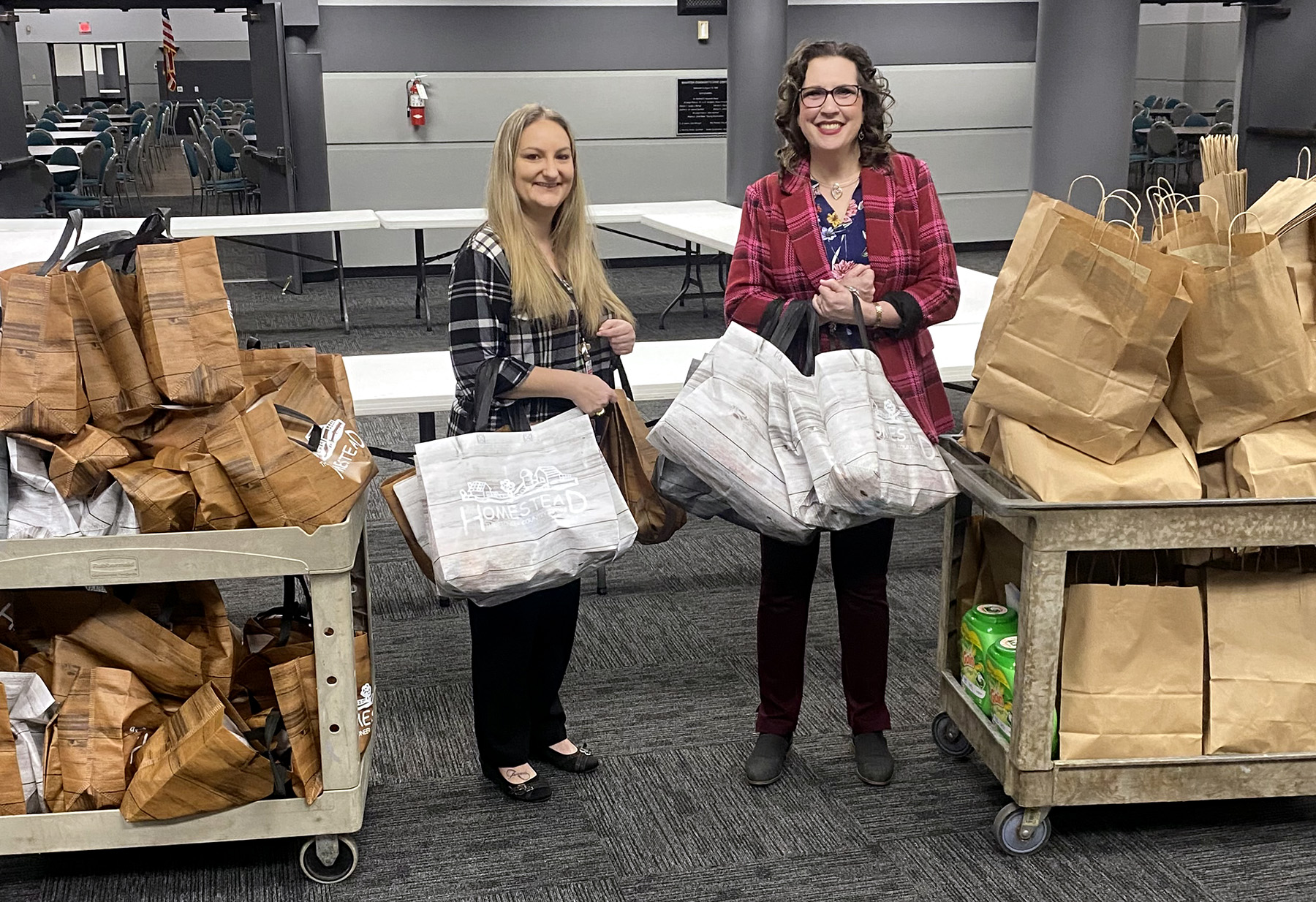 Wharton County Junior College provides food and toiletries to students through the Pioneer Homestead pantry. Pictured gathering donations for the pantry donated by the Wharton Rotary Club are, from left, WCJC Counselor Shannon Glardon and WCJC's Director of Counseling and Disability Services Amber Barbee.