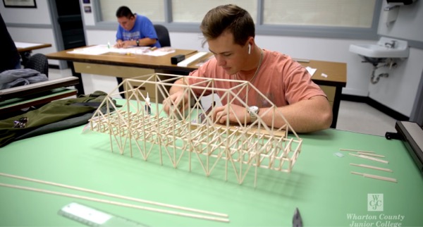 Student building a model bridget