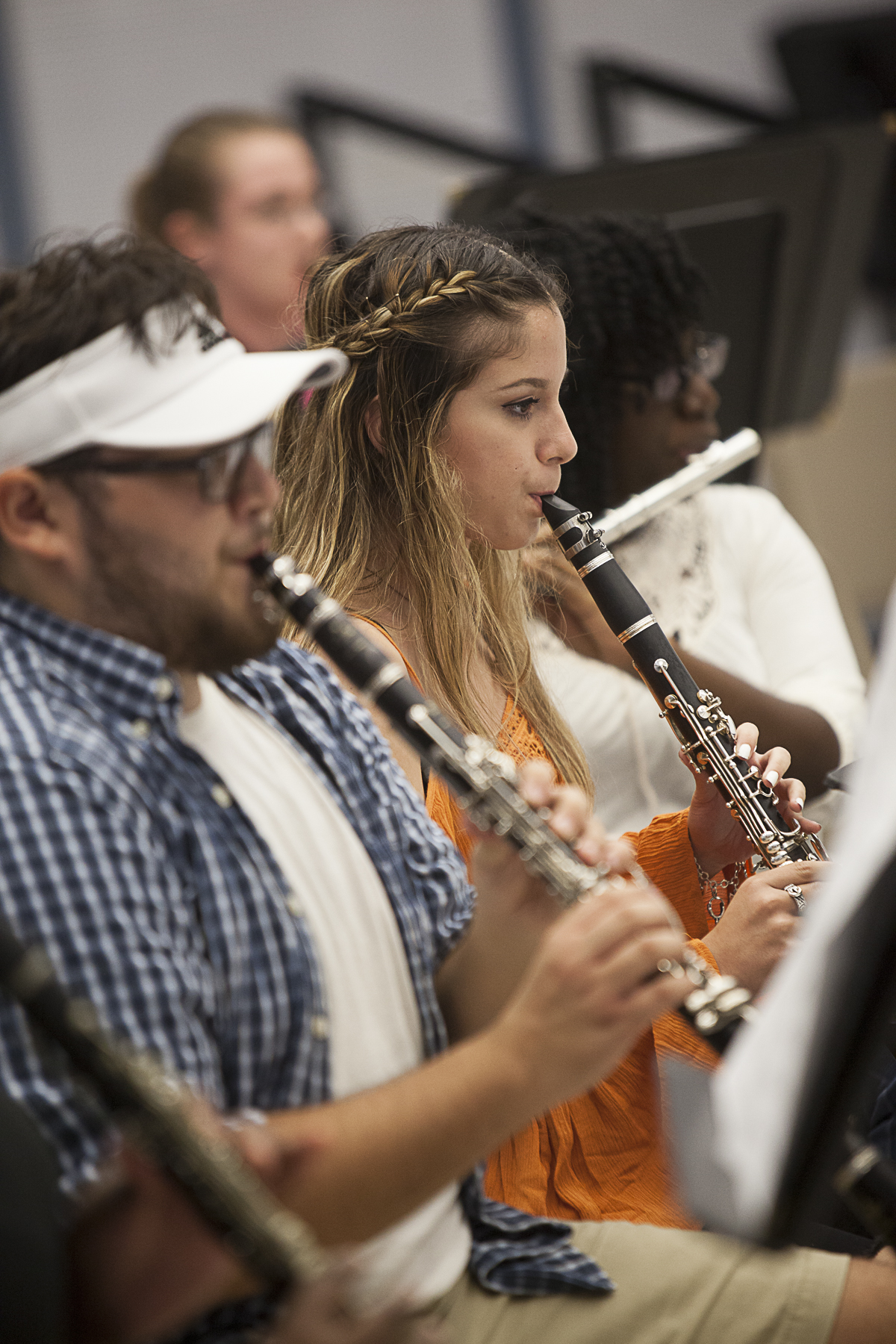Wharton County Junior College band members, from left, Evan Stavena, Rocio Alanis and Destiny Denton rehearse for the upcoming Country and Western concert. 