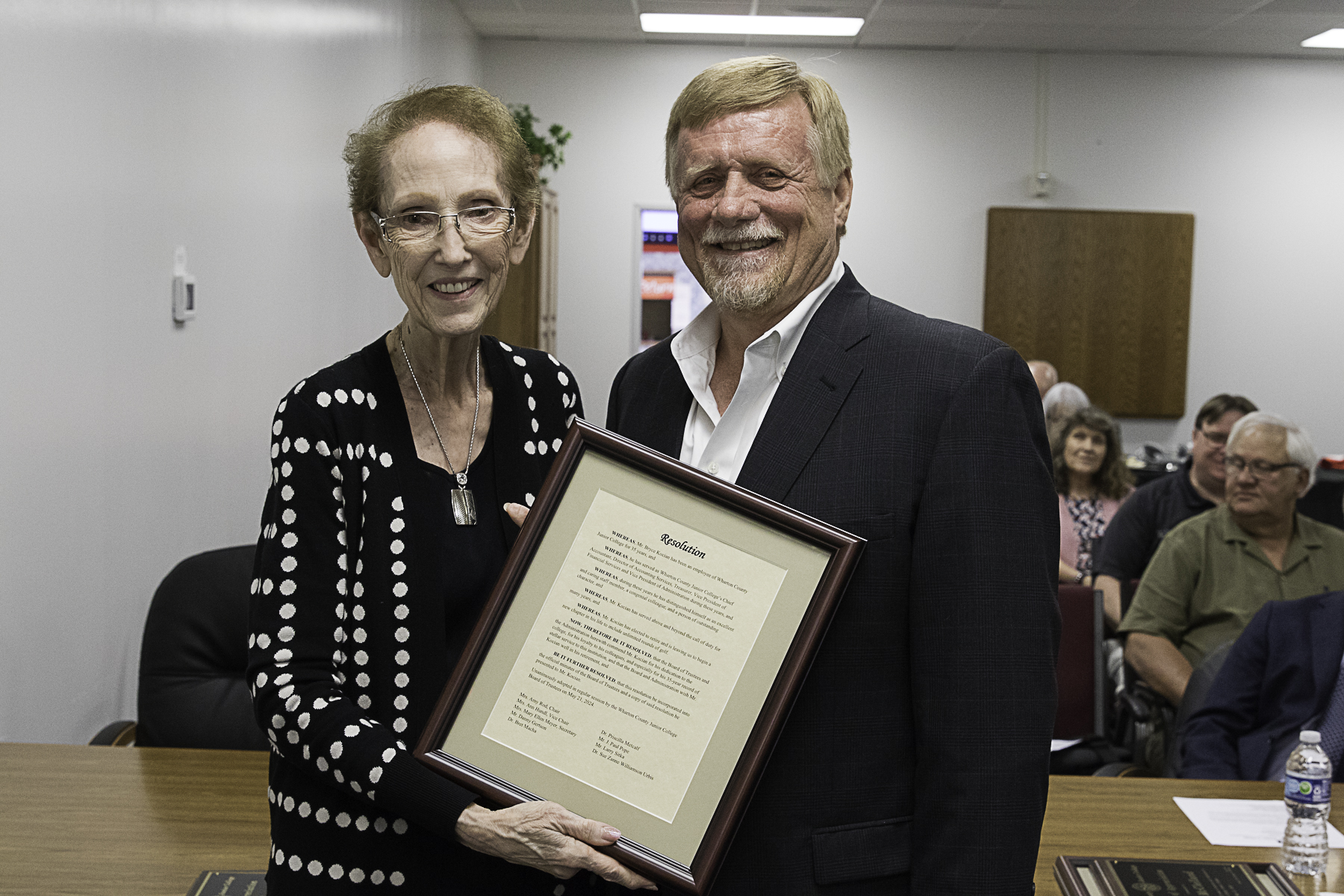 WCJC President Betty McCrohan presents a resolution to Bryce Kocian for his 35 years of service to the college. 