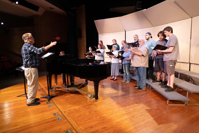 The Wharton County Junior College Choir and members of the Wharton Community Choir rehearse for their upcoming concert, 