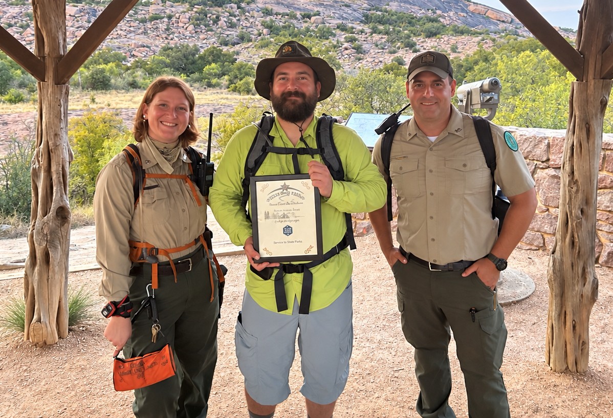 Wharton County Junior College Instructor of Geology Peter Anderson was recently recognized by Texas Parks and Wildlife Department for his contributions to the park service's educational programs. Pictured, left to right, are TPWD ranger Hannah Pickens, Anderson and TPWD ranger Andrew Berezin.