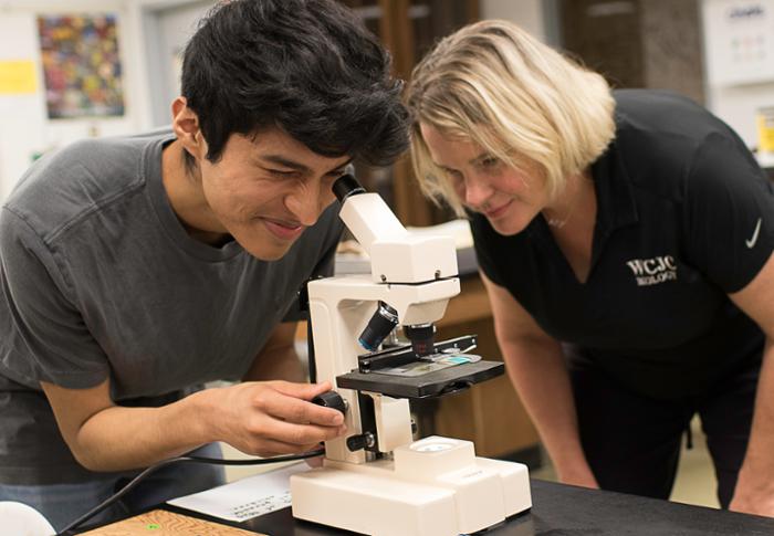 Beginning for the Fall 2025 semester, Wharton County Junior College’s core curriculum will no longer require science labs. Science labs remain a requirement for science-related majors but not for non-science majors. Pictured is WCJC student Philip Salinas of Wallis utilizing a microscope under the guidance of WCJC Biology Department Chair Jennifer Mahlmann.